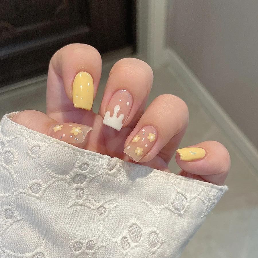 Sunny Delight Medium Square Press On Nails in Soft Yellow with Floral Accents and Whimsical Drip Design