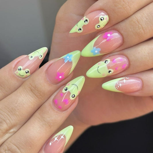 Frog Garden Dream Long Pointed Stiletto Neon Green Press On Nail Set Featuring Cute Smiley Faces and Floral Designs