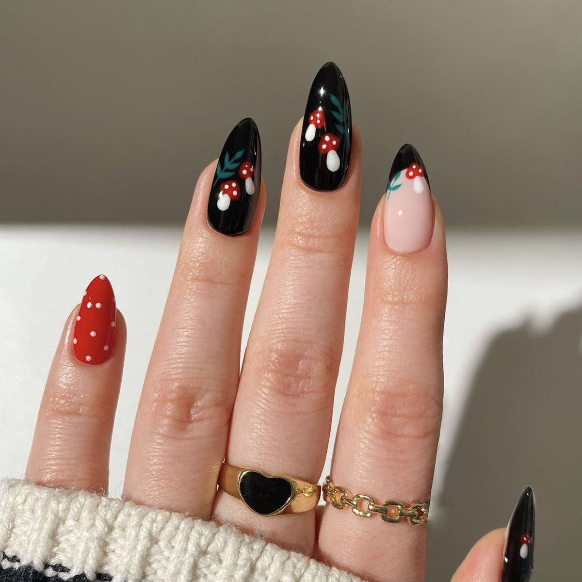 Festive Enchantment Long Almond Shaped Red Black and Cream Press On Nail Set with Whimsical Floral Design