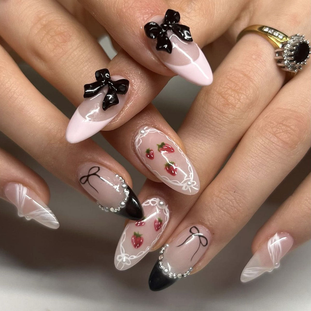 Charming Strawberry Delight Long Almond Press On Nail Set Soft Pink Black and White with Bow and Floral Accents