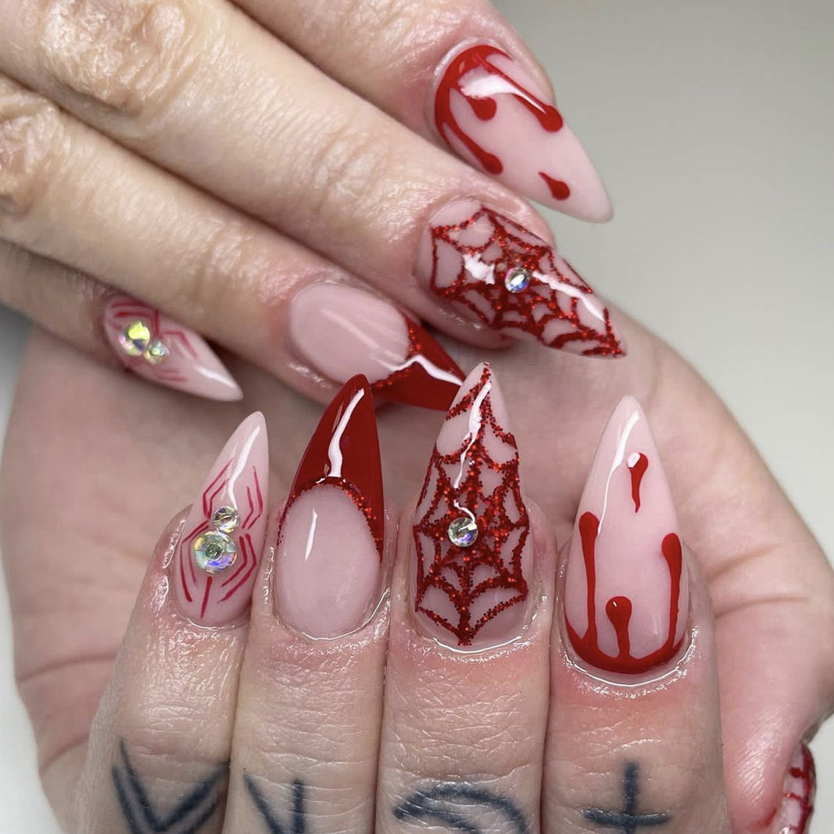 Spooktacular Long Stiletto Red and Beige Press On Nail Set with Glitter Spiderweb Design and Rhinestones