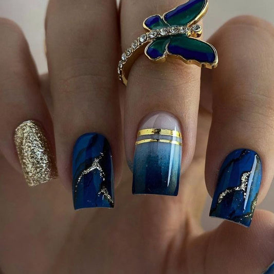 Enchanted Ocean Long Square Blue Glitter Ombre Press On Nail Set with Gold Stripes and Artistic Detailing