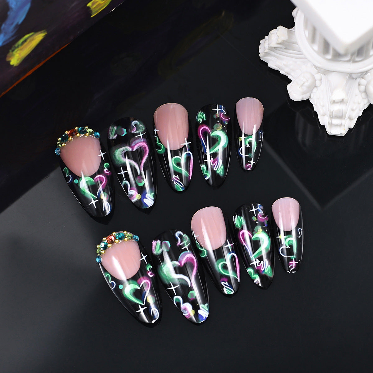 Cosmic Glow Long Almond Press On Nail Set in Black with Neon Heart Design and Gem Accents