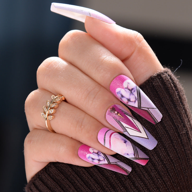 Whimsical Floral Fantasy 24 Long Coffin Pink and Purple Press On Nail Set with Glossy Finish and Artistic Designs