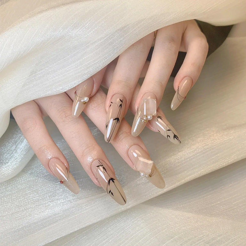 Elegant Charm Long Almond Beige Press On Nail Set with Pearl Accents and Artistic Detailing