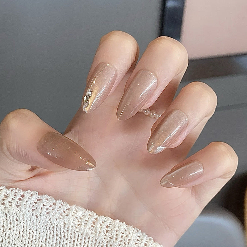 Glamorous Elegance Medium Almond Shaped Warm Beige Nail Set with Glittering Accent