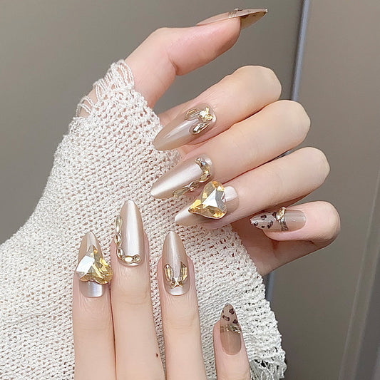 Glamorous Elegance Medium Almond Beige Nails with Shimmering Gem Accents