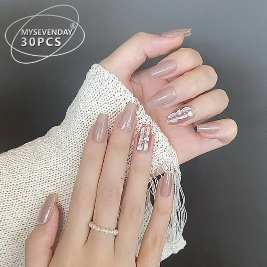 Elegant Bliss Medium Coffin Beige Nails with Stunning Gemstone Accents