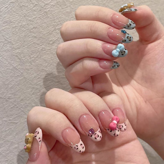 Charming Playful Leopard Print Medium Almond Shaped Pink and Blue Press On Nail Set with Adorable Bow and Character Decorations