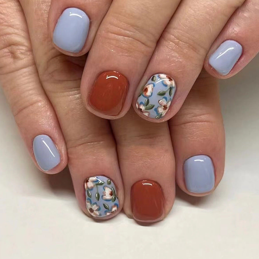 Floral Serenity Short Oval Blue and Rust Press On Nail Set with Beautiful Hand-Painted Floral Design