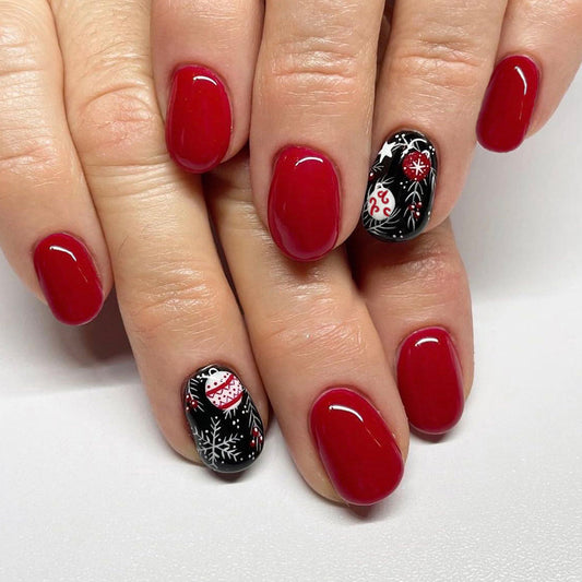 Winter Wonderland Short Oval Red and Black Holiday Themed Press On Nail Set with Festive Snowman and Snowflake Designs