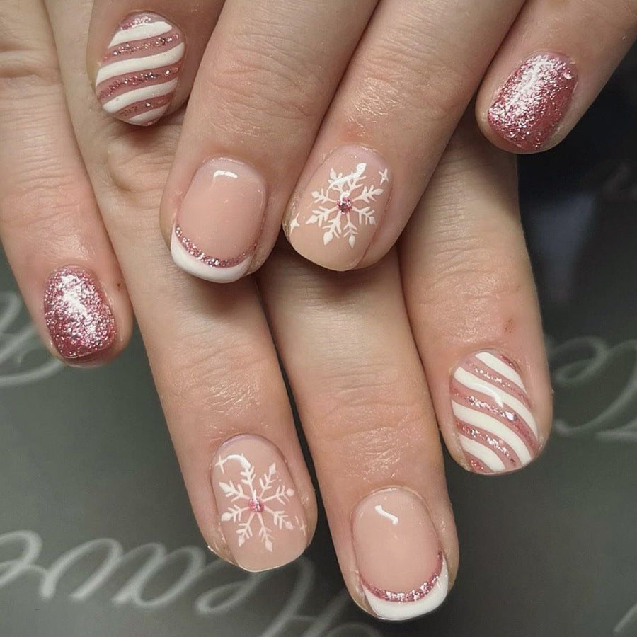 Winter Wonderland Short Square Pink Glitter Press On Nail Set with Festive Snowflake and Candy Cane Designs