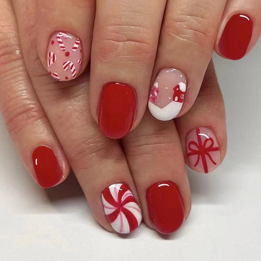 Holiday Cheer Festive Medium Oval Red and Pink Candy Themed Press On Nail Set with Unique Hand-Painted Design