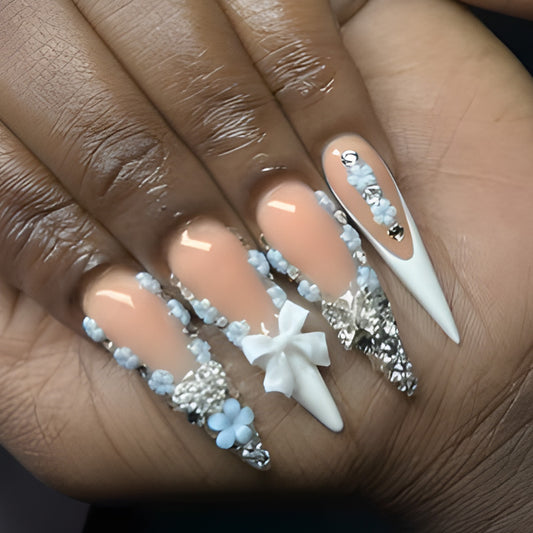 Whimsical Garden Soft Beige Long Stiletto Nail Set with Floral Embellishments and Shimmering Accents