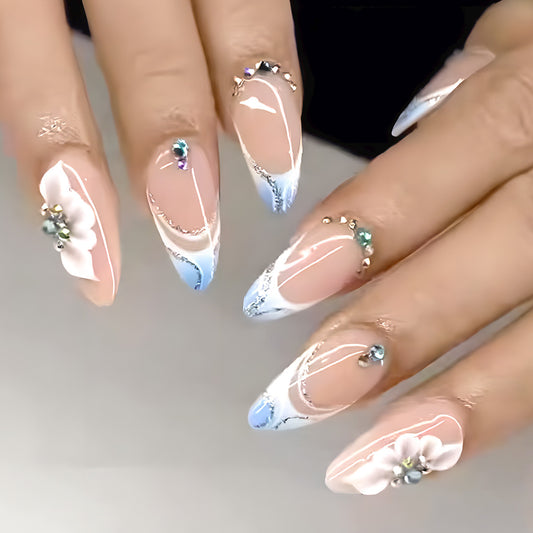 Whimsical Ocean Breeze Medium Almond Blue Ombre Nails with Floral Accents and Gemstone Embellishments