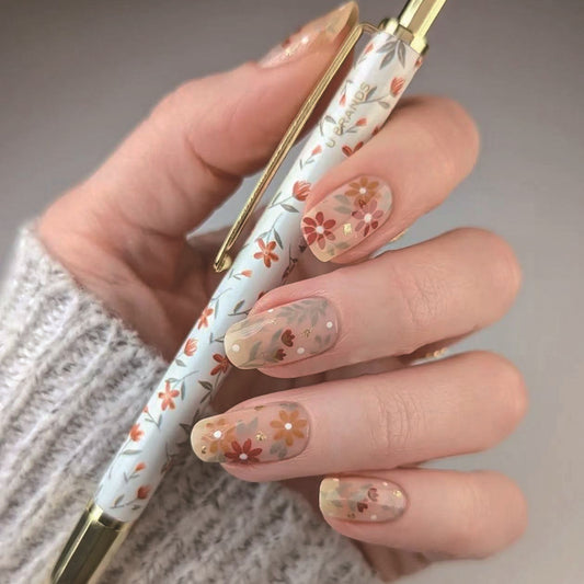 Floral Garden 1 Long Oval Transparent Press On Nail Set with Vibrant Flower Designs and Gold Accents