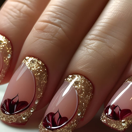 Gilded Floral Elegance Short Square Shaped Pink and Gold Press On Nail Set with Glittering Accents and Artistic Designs