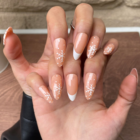 Winter Wonderland Long Almond Beige Nails with White Snowflake and French Tip Design