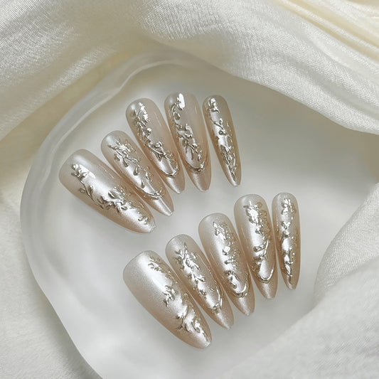 Elegant Blossom Press On Nail Set Long Almond Shape Shimmering Champagne Color with Intricate Silver Floral Design