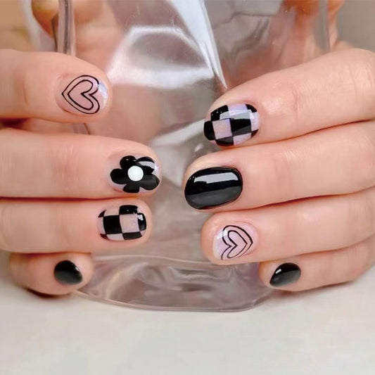 Urban Chic Medium-Length Squoval Black Press On Nail Set with Geometric and Floral Accents