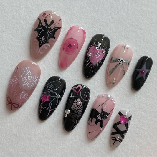 Spooktacular Almond Long Black and Pink Press On Nail Set with Unique Halloween Designs and Gems