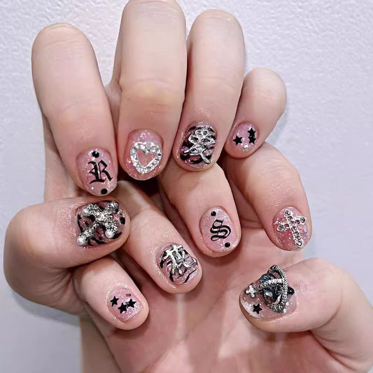 Glam Rock Vibes Short Round Pink Press On Nail Set with Glitter Accents and Unique Charm Designs