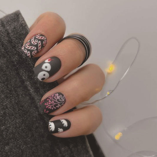 Festive Winter Wonderland Medium Square Black and Pink Print Press On Nail Set with Unique Candy Cane and Polar Bear Designs