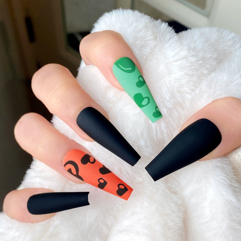 Vibrant Heartbeat Extra Long Coffin Press On Nail Set Green Black and Orange with Fun Patterns and Matte Finish