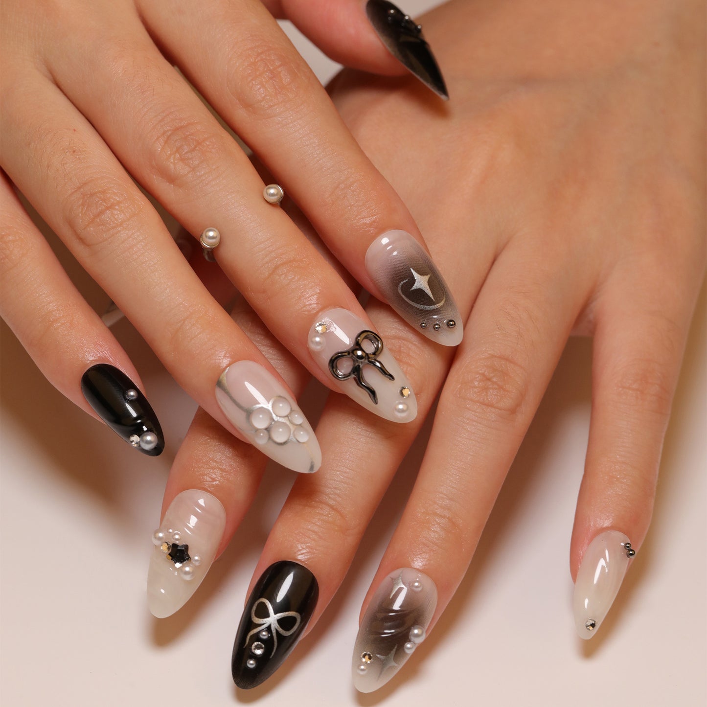 Chic Elegance Long Almond Black and White Press On Nail Set with Unique Scissor and Pearl Designs