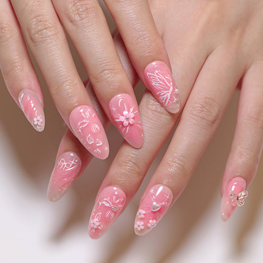 Whimsical Blossom Medium Almond Pink Press On Nail Set with Floral and Butterfly Decorations