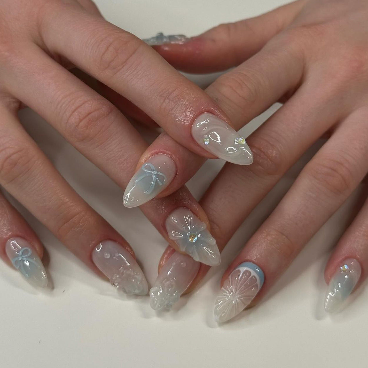 Whimsical Garden Long Almond Cloud Blue and Clear Press On Nail Set with Floral and Bow Accents