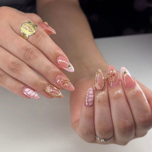 Elegant Floral Fantasy Medium Almond Pink Nails with Delicate Gold Accents and Charming Flower Designs