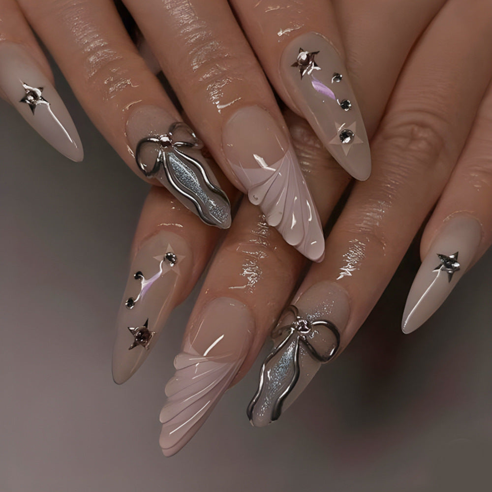 Elegant Night Sky Long Almond Press-on Nails in Beige with Iridescent Wings and Metallic Accents