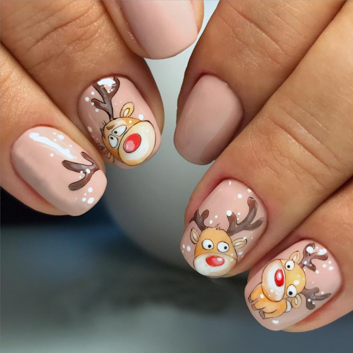 Festive Reindeer Themed Medium Square Beige Press On Nail Set with Whimsical Rudolph Designs and Glitter Accents