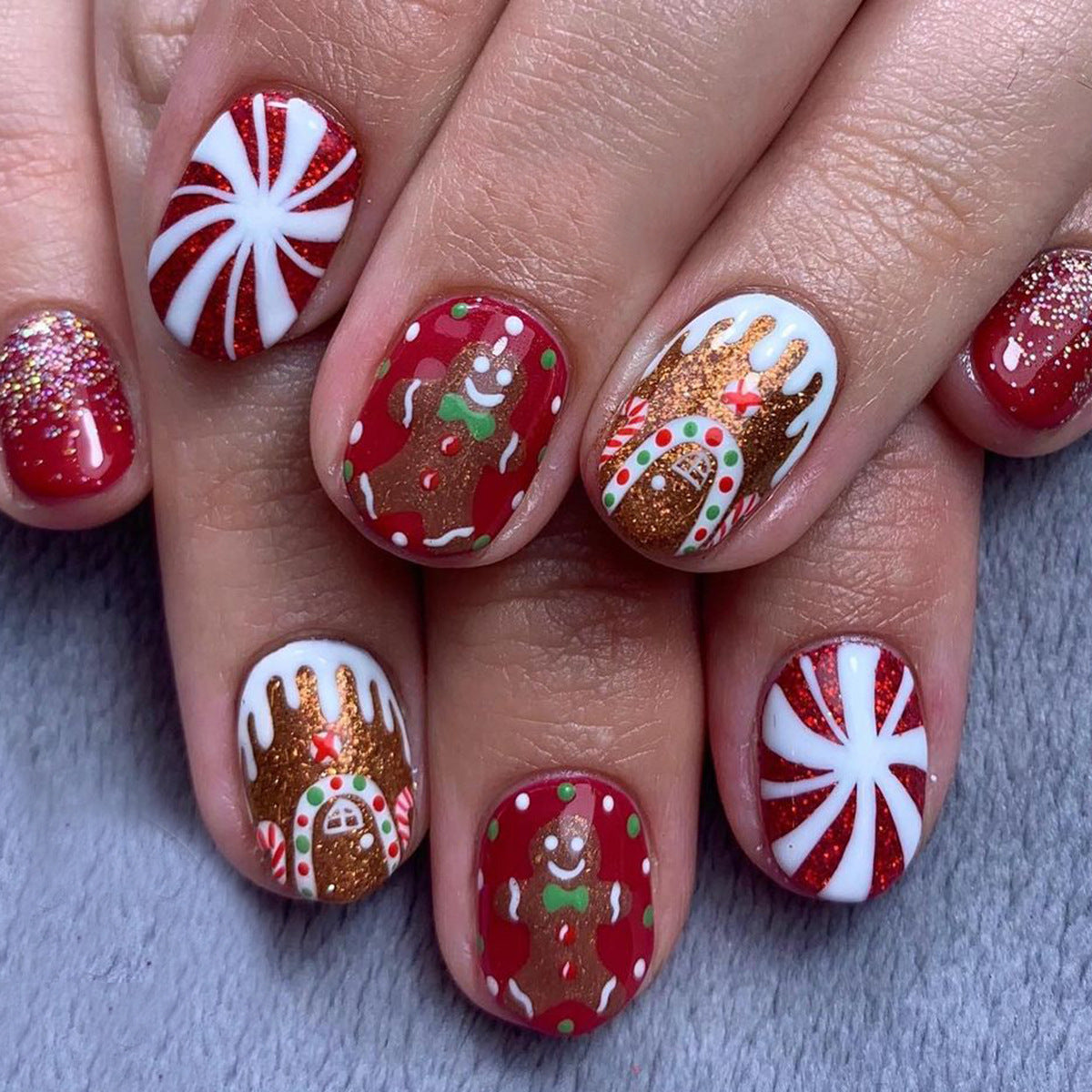 Gingerbread Wonderland Short Oval Red Festive Press On Nail Set with Glitter and Whimsical Designs