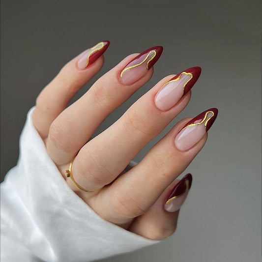 Glamorous Gold Wave Long Almond Red and Clear Press On Nail Set with Unique Gold Accent Design