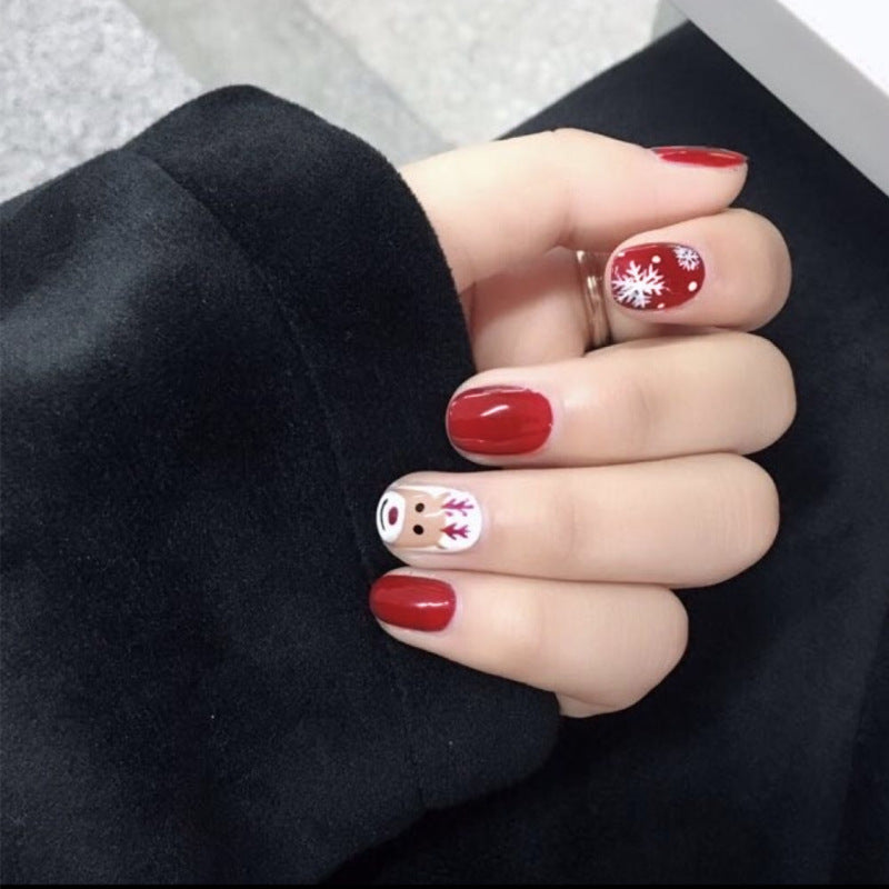 Winter Wonderland Short Length Round Press On Nails in Classic Red with Festive Reindeer Accents