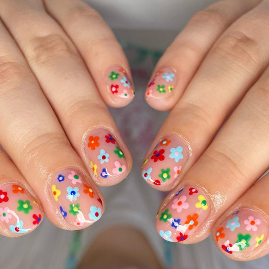 Spring Bloom Short Oval Multicolor Floral Press On Nail Set with Clear Base and Vibrant Flower Accents