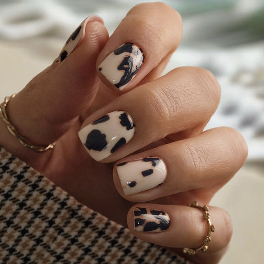 Wild West Chic Square Press On Medium Nail Set in Beige and Black with Cow Print Design for Trendy Nail Art Enthusiasts