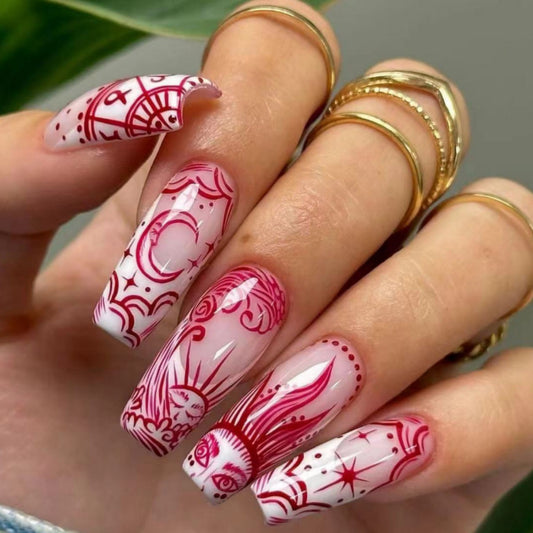 Cosmic Elegance Long Coffin Press On Nail Set in Transparent Pink with Intricate Red Zodiac Designs