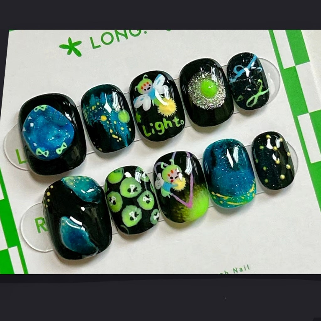 Galactic Glow Medium Square Black and Green Press On Nail Set with Sparkling Designs and Celestial Patterns