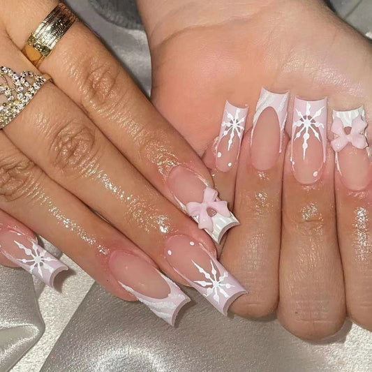 Whimsical Winter Wonderland Long Square Pink Nails with Snowflake and Bow Accents