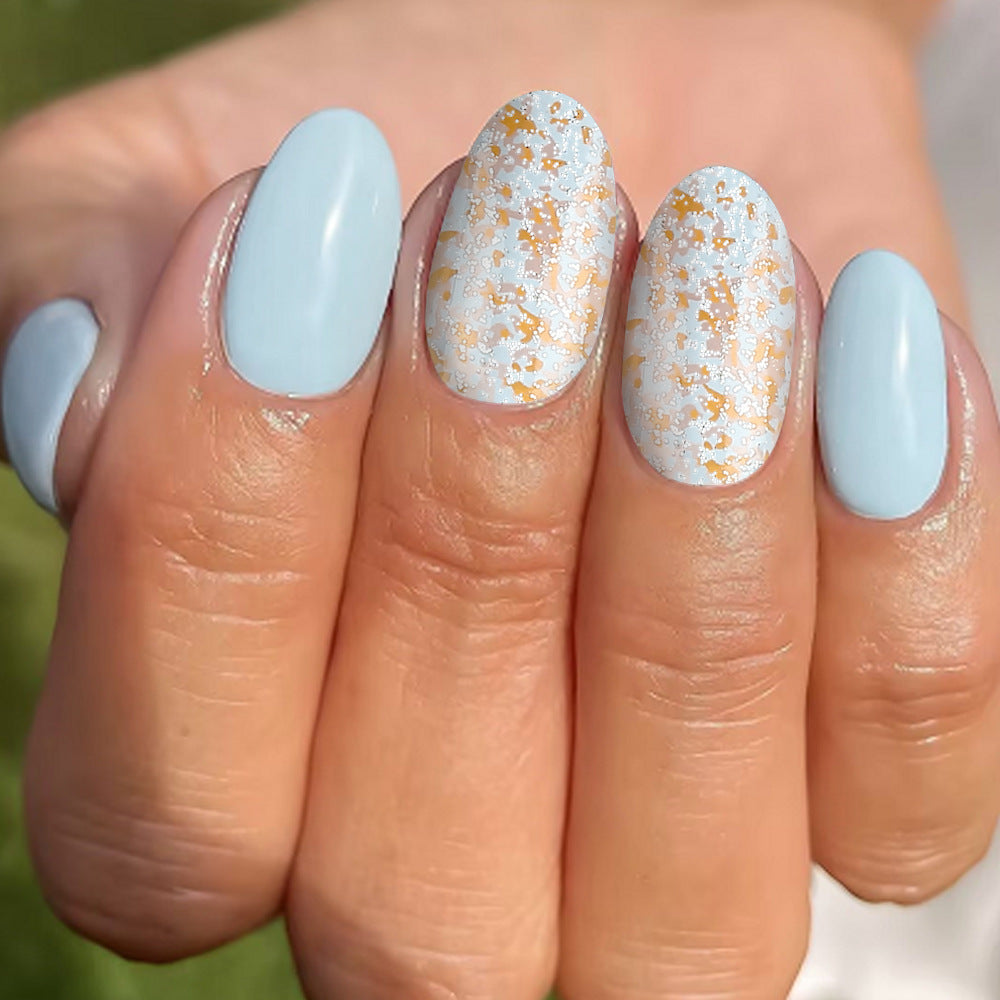 Serene Sky Blue Oval Press On Nail Set Medium Length with Glittery Gold Accents