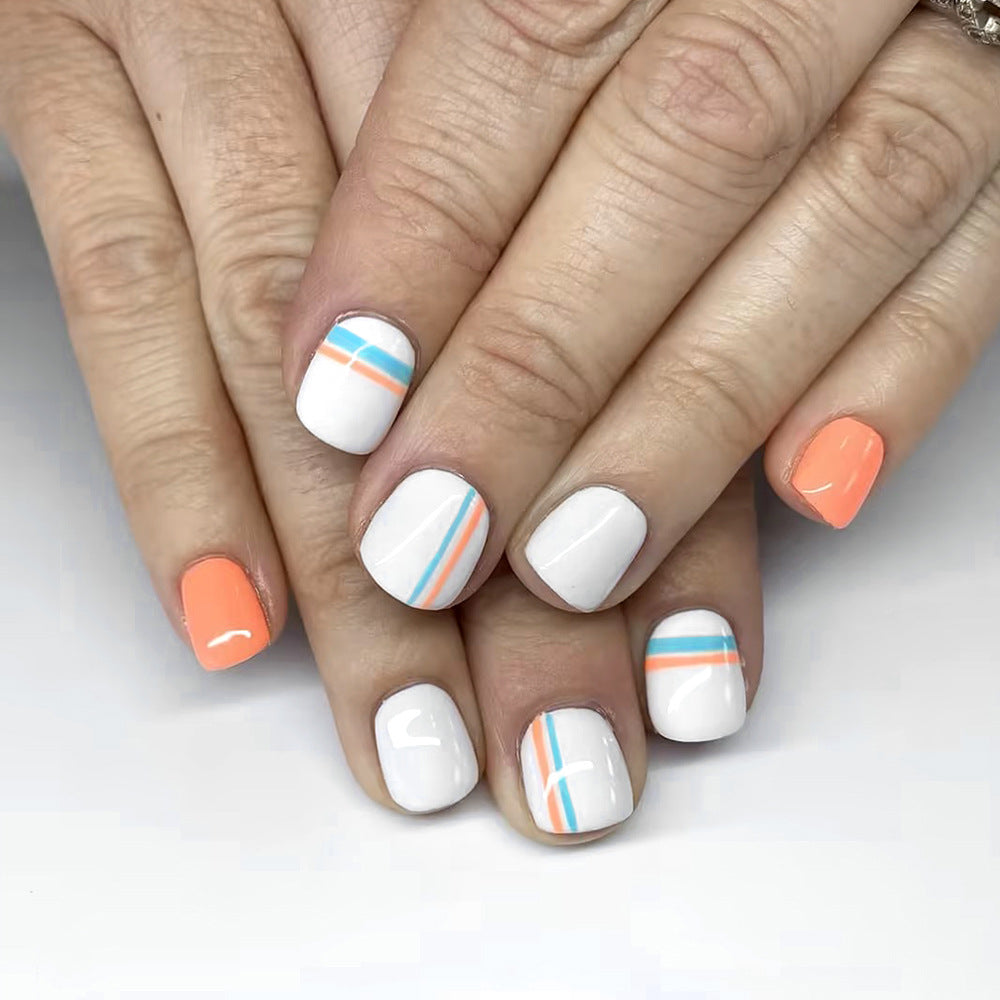 Tropical Vibes Short Oval Press On Nail Set in White and Orange with Unique Striped Designs