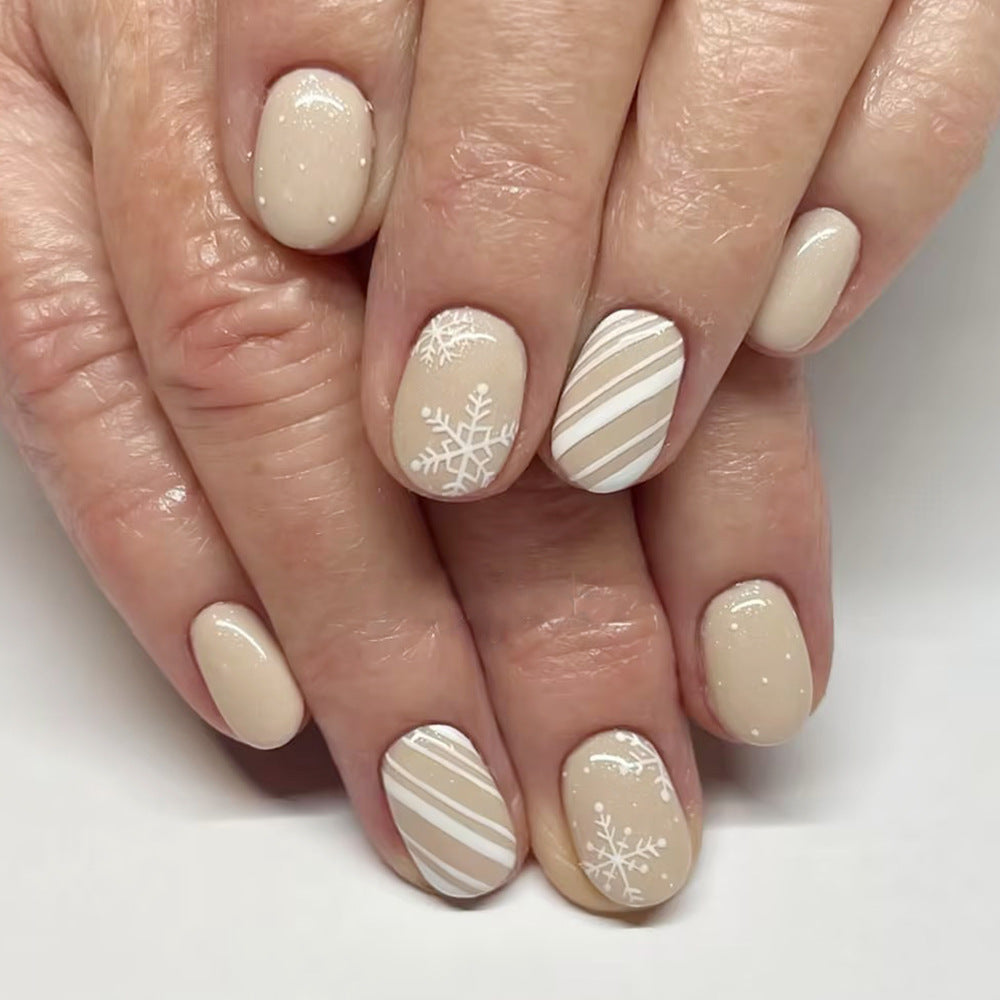 Winter Wonderland Oval Shaped Beige Press On Short Nail Set with Elegant White Snowflake and Stripe Designs