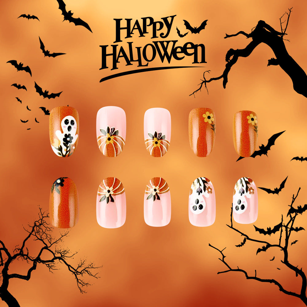 Spooktacular Halloween Themed Long Oval Orange and Pink Press On Nail Set with Unique Pumpkin and Ghost Designs