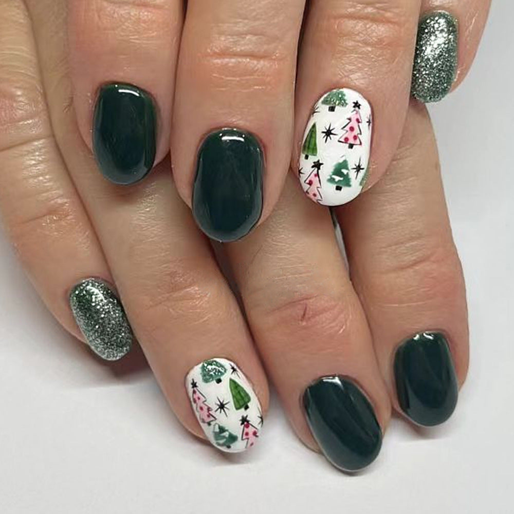 Festive Forest Inspired Medium Oval Green and White Press On Nail Set with Christmas Tree Design and Glitter Accents