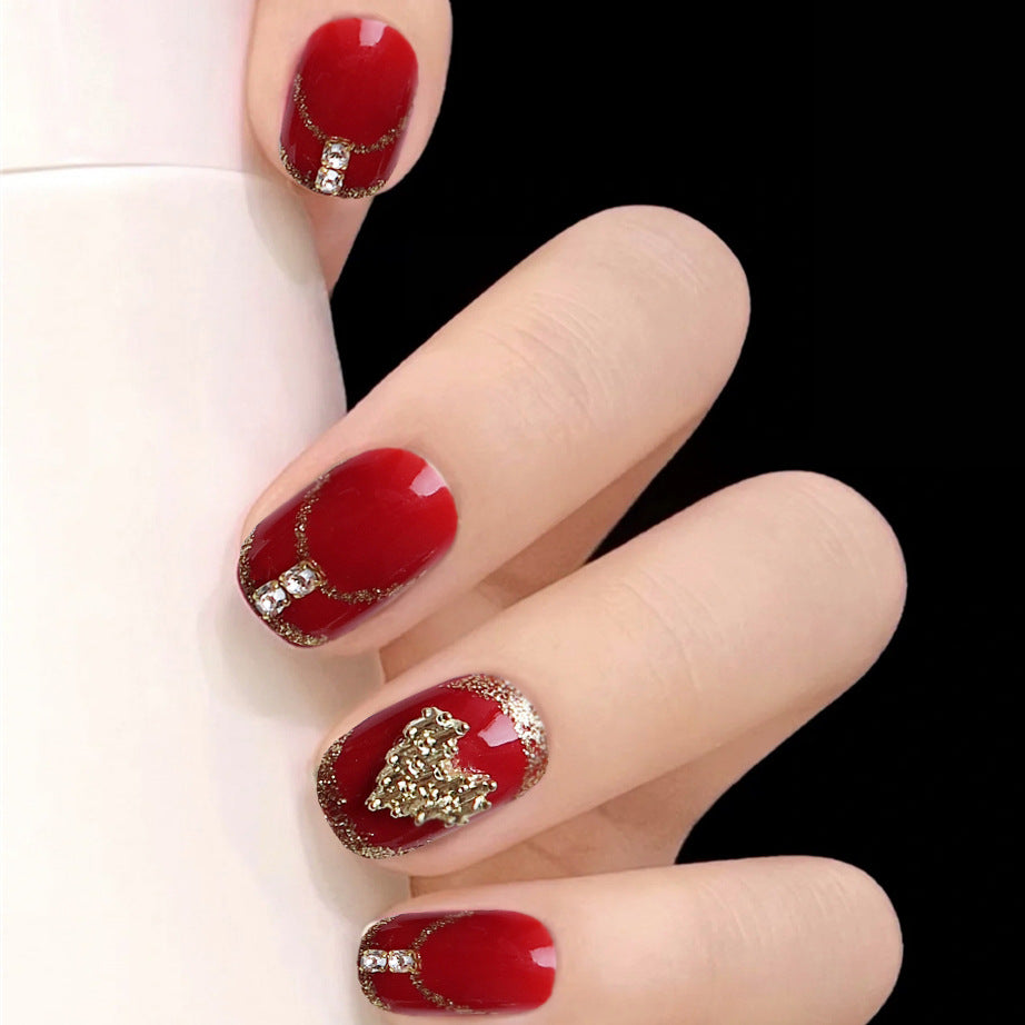 Glamorous Holiday Red Short Squoval Press On Nails with Glitter Accents and 3D Golden Christmas Tree Design