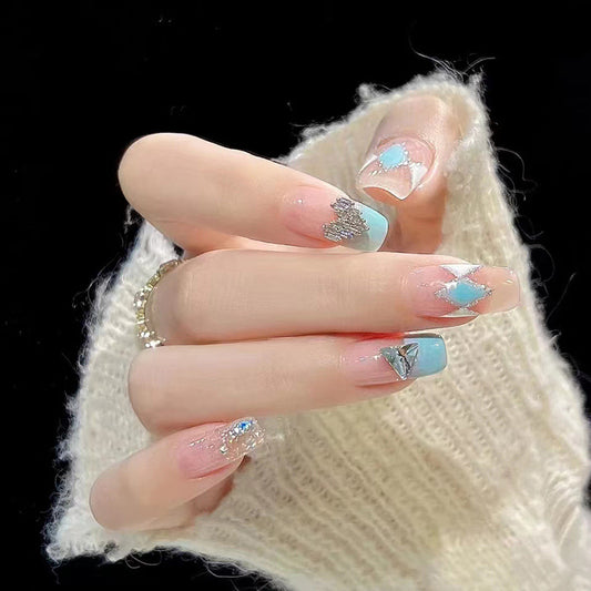 Enchanted Winter Blue Ombre Long Coffin Press-On Nail Set with Glitter Accents and Rhinestone Embellishments