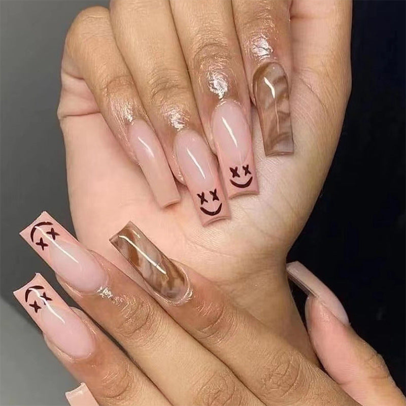 Cosmic Charm Long Coffin Beige Press On Nails with Smiley Face Accents and Clear Marble Design